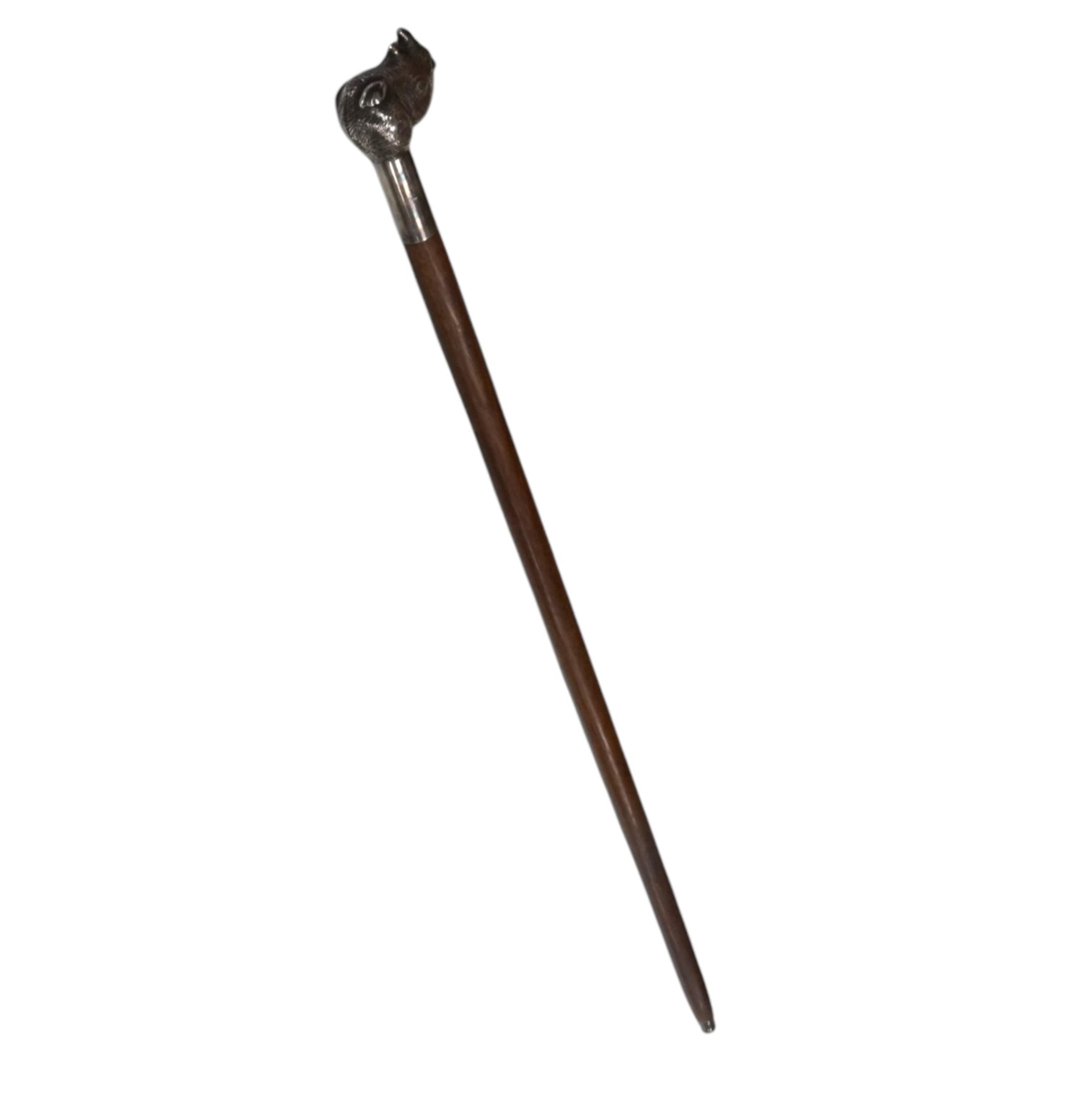 A white metal mounted hardwood ‘rhino head’ mounted walking cane, 93.5cm. Condition - fair to good